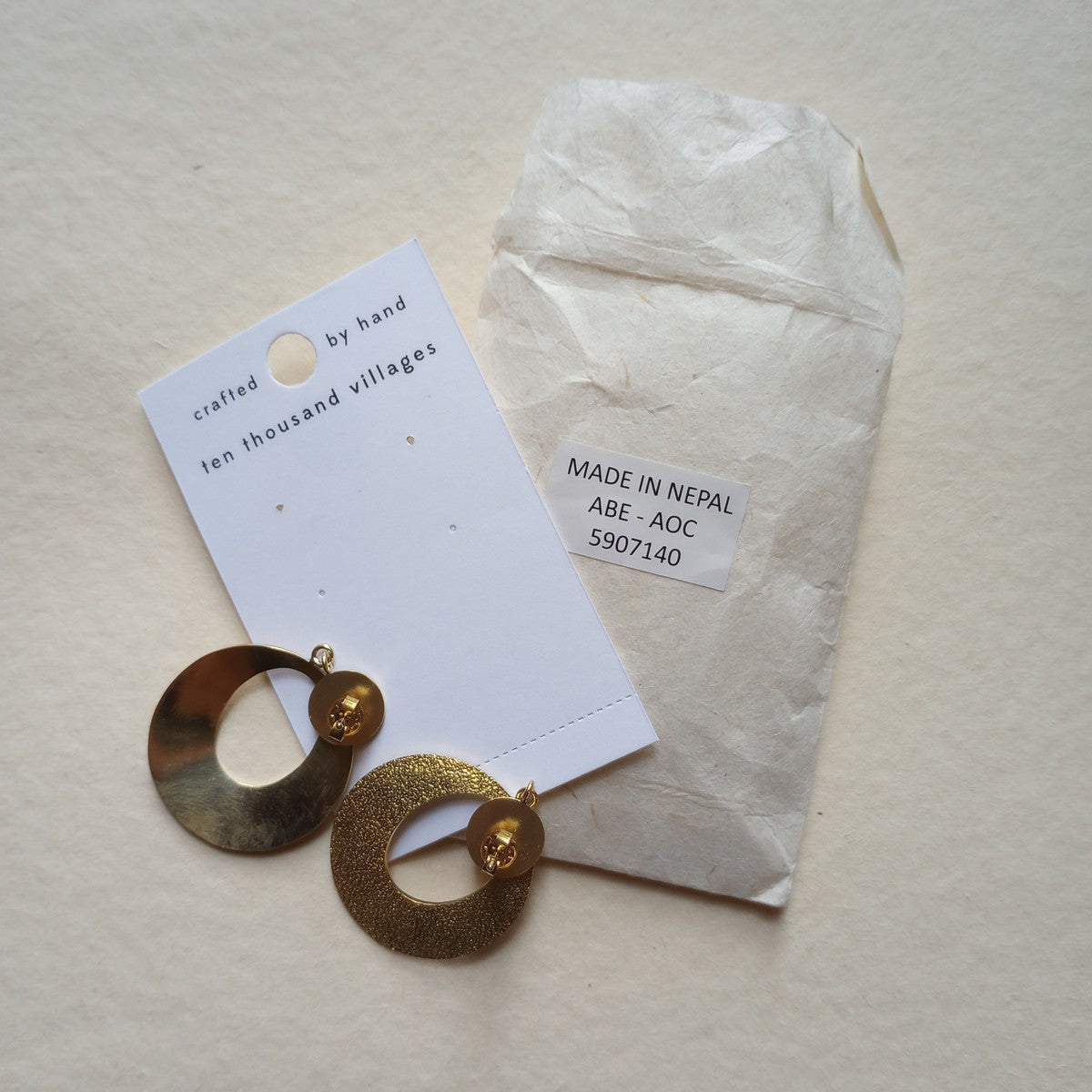 Earrings textured discs w/oval cutout br 1.75L br