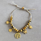 Bracelet beaded charm horn/lthr/brass adj nat/br