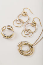 Ring crossing spiral bombshell .5W silver/brass