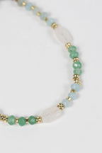 Bracelet moonstone/onyx cttn cord adj wht/aqua/gld