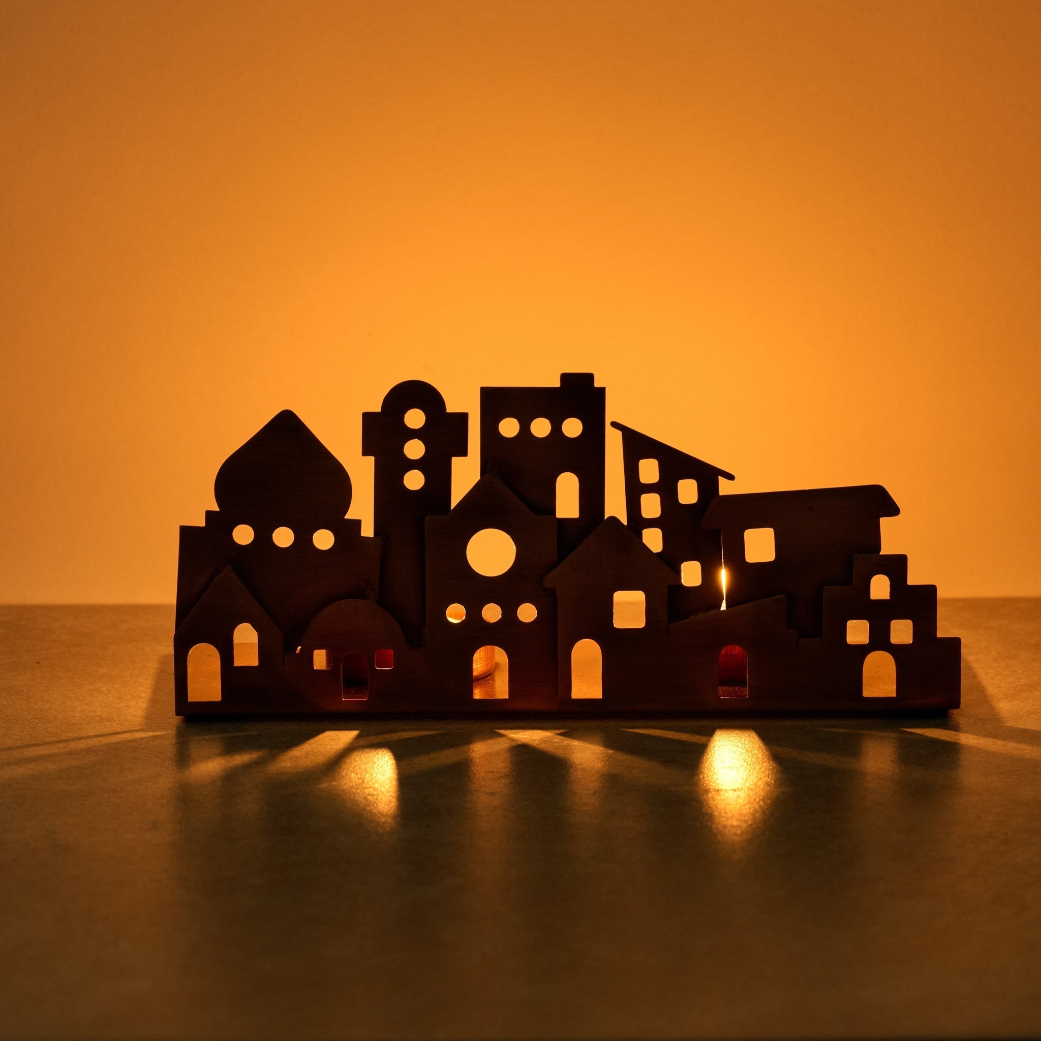 Candleholder village cutout iron 8Lx3.5H antq cppr