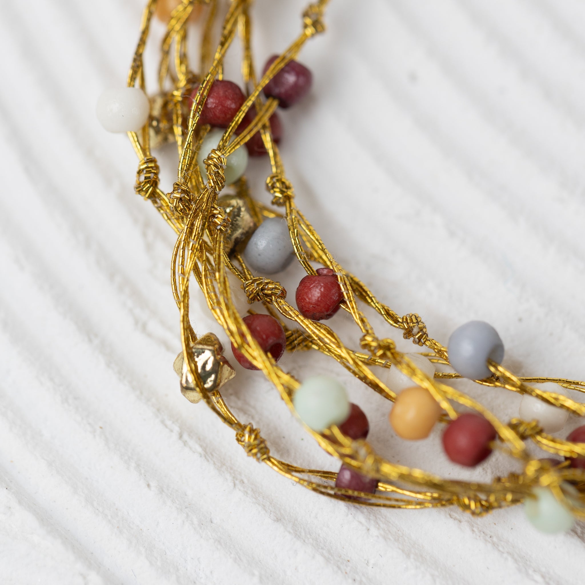 Necklace multistrnd bd bone/zari 17L br/wht/orng