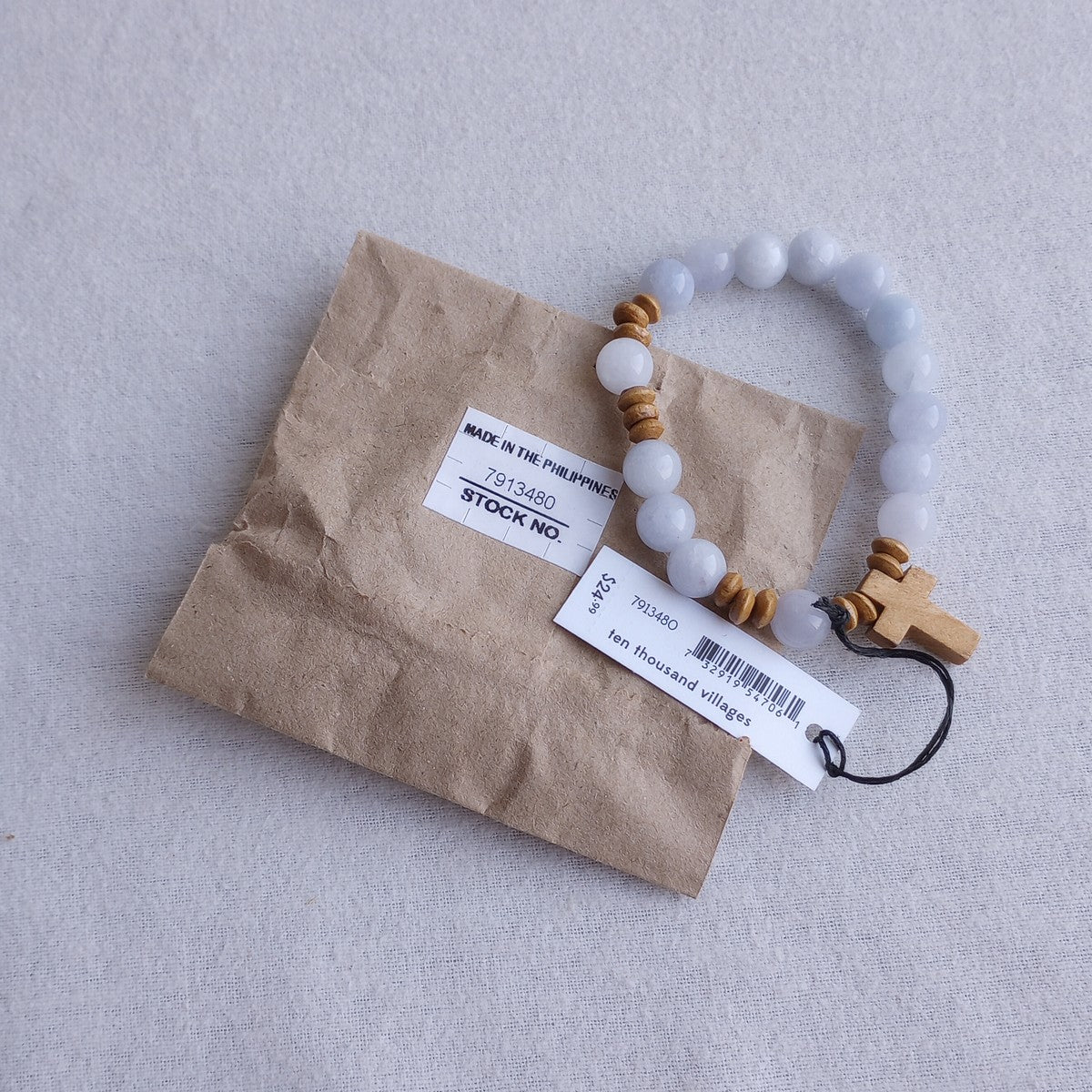 Bracelet stretch w/cross charm stn/wd lt blu/brn
